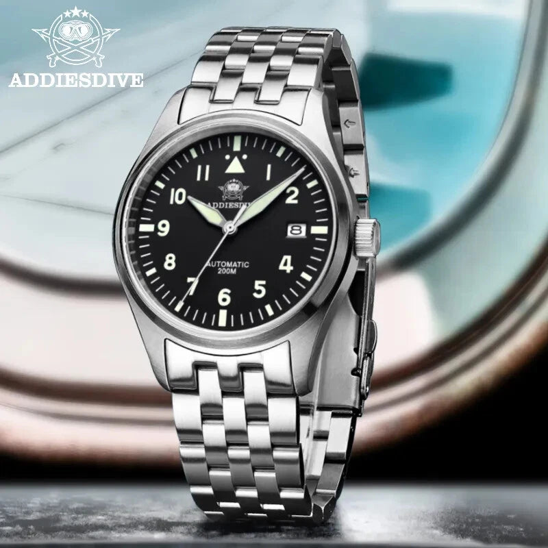 Silver wristwatch with black dial on a reflective surface, featuring the ADDIESDIVE brand.