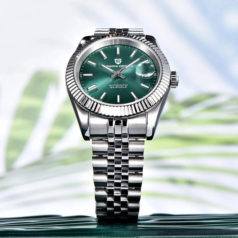 Silver watch with a green face on a blurred natural background
