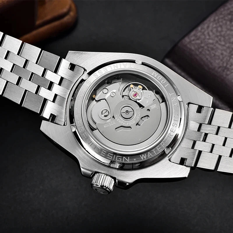 Close-up of a silver watch with a detailed mechanism on a dark background