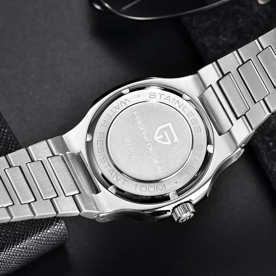 Close-up of a silver watch with brand logo on a dark background