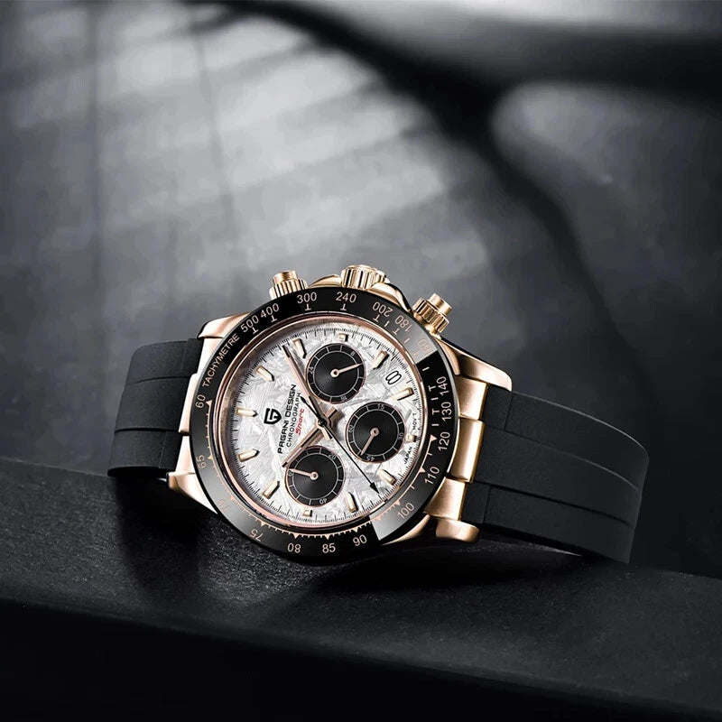 Luxury watch with black strap and rose gold case on a dark surface