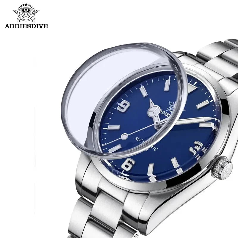 Silver watch with blue dial and magnifying glass on a white background, featuring ADDIESDIVE brand.