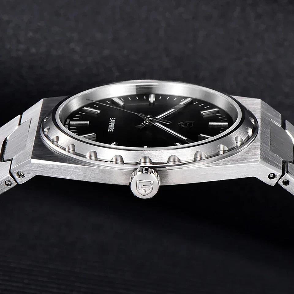 Silver watch with black dial on a dark background
