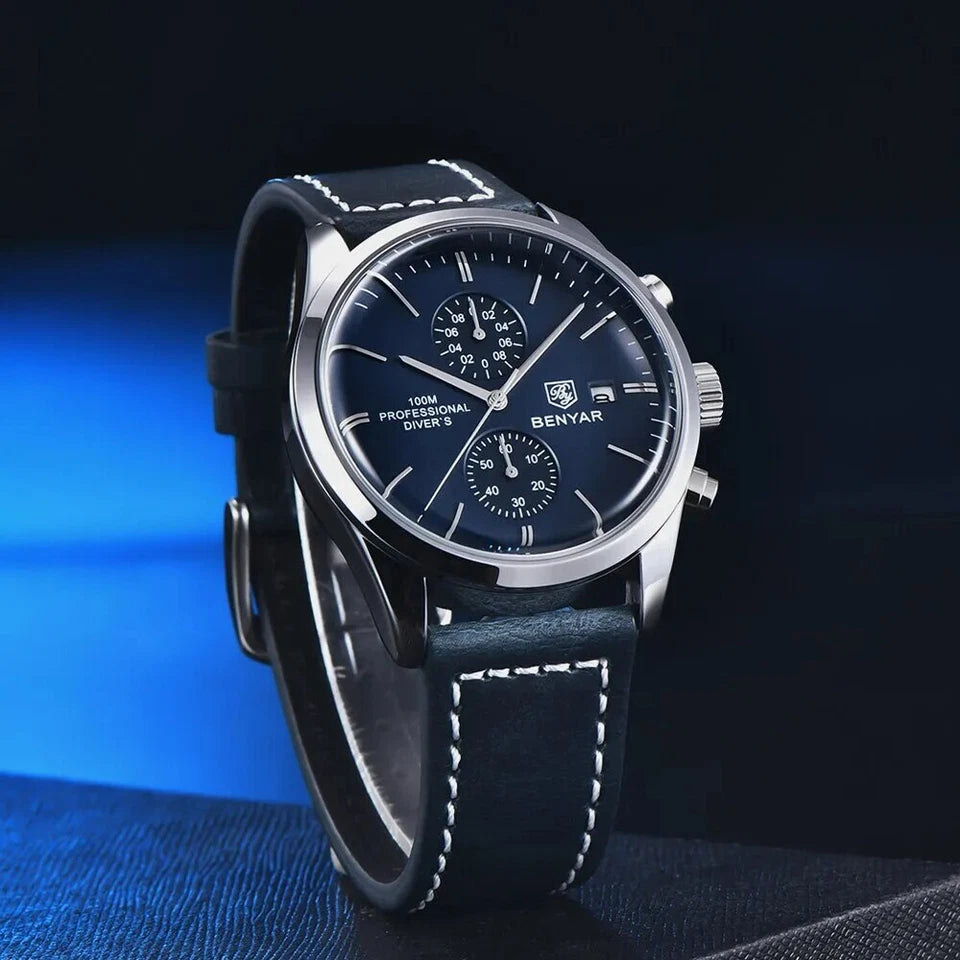Wristwatch with black leather strap and blue dial on a dark background