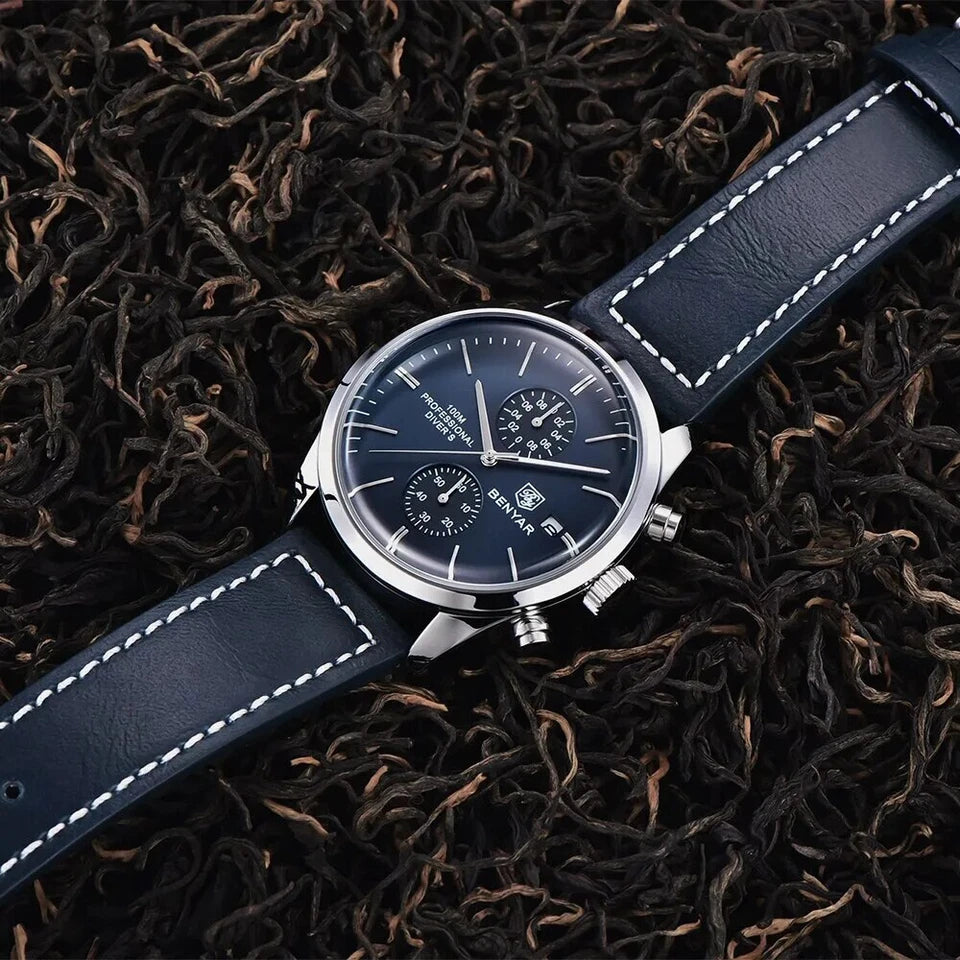 Wristwatch with blue strap on a bed of dried tea leaves