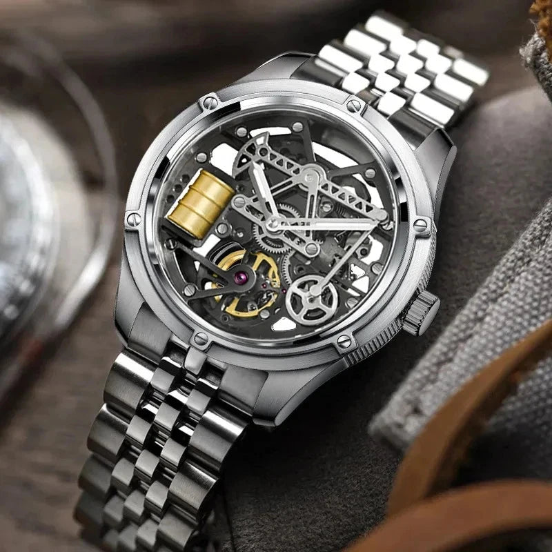 Silver mechanical watch with a detailed face on a textured surface