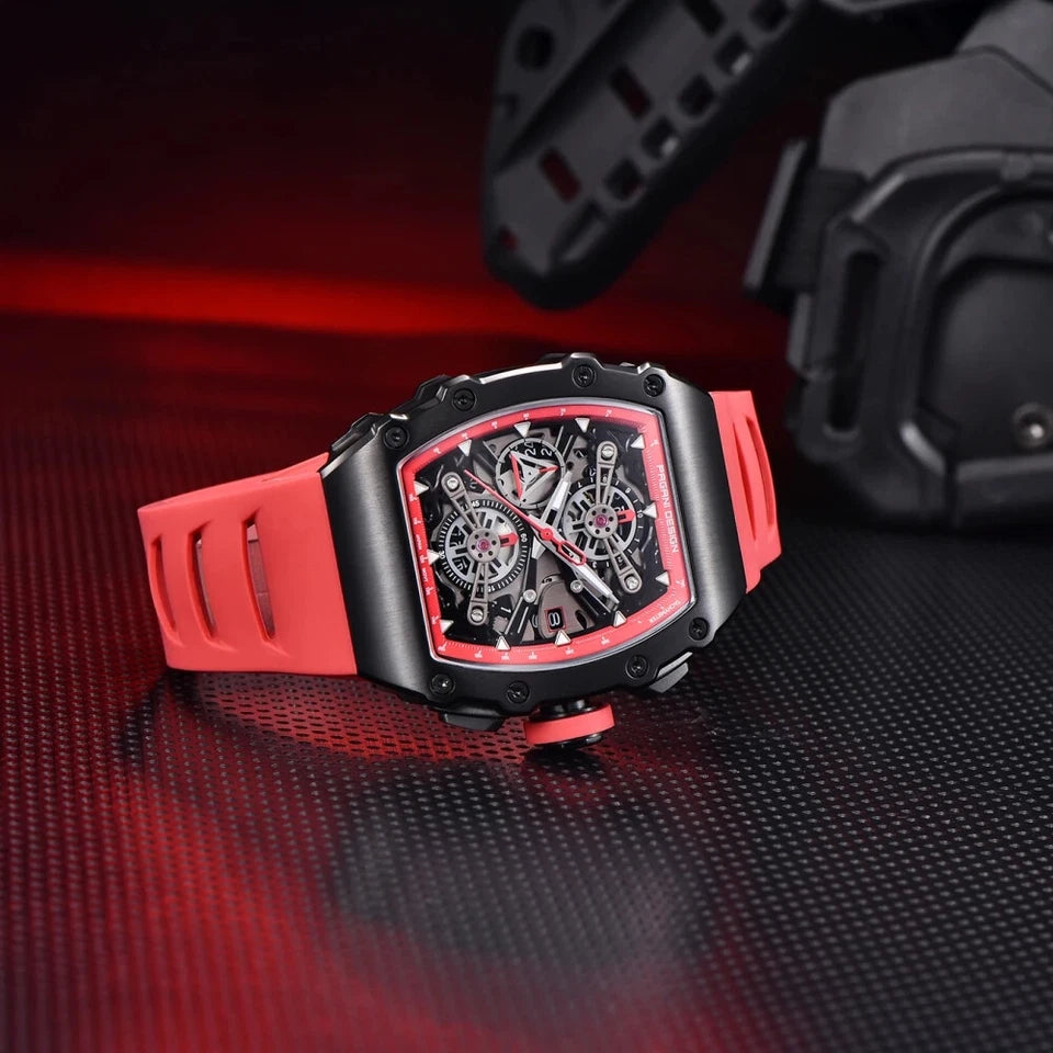 Luxury watch with red and black design on a reflective surface