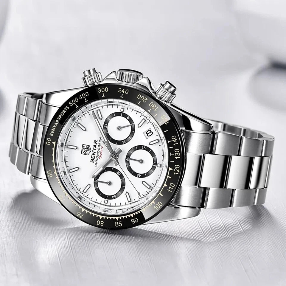 Silver wristwatch with a detailed face on a white background