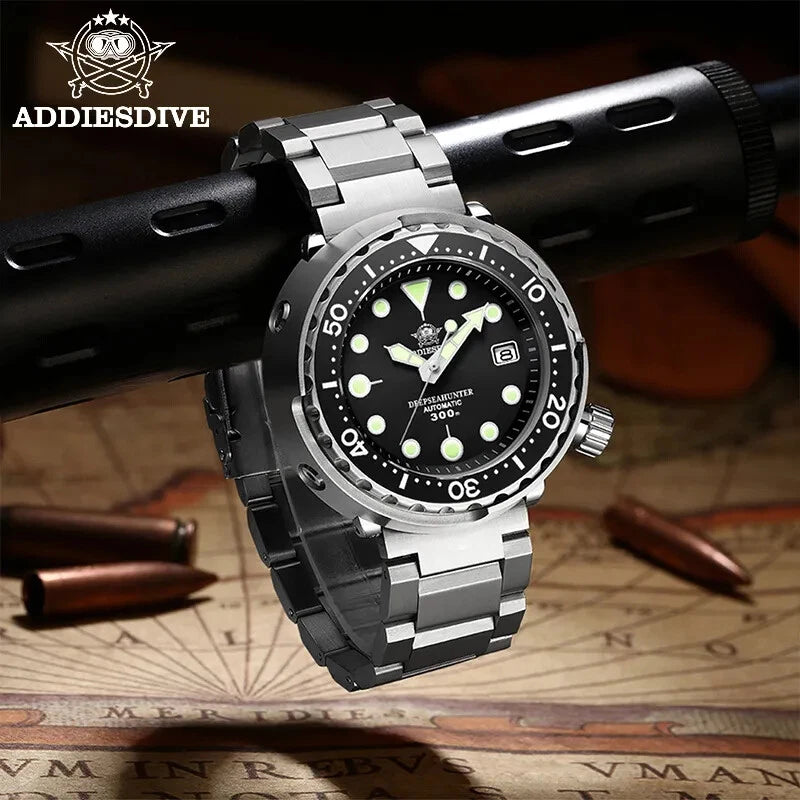 Silver wristwatch with black dial on a map background, featuring ADDIESDIVE branding.