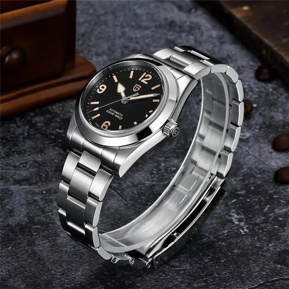 Silver wristwatch with black dial on a textured surface