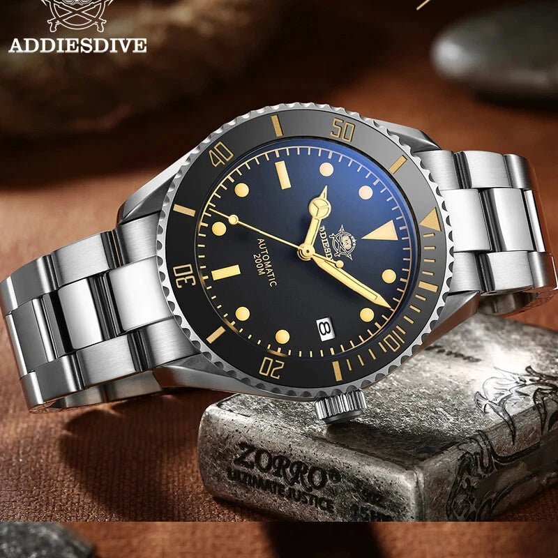 Silver watch with a black face on a stone surface, featuring the brand 'ADDIESDIVE'.