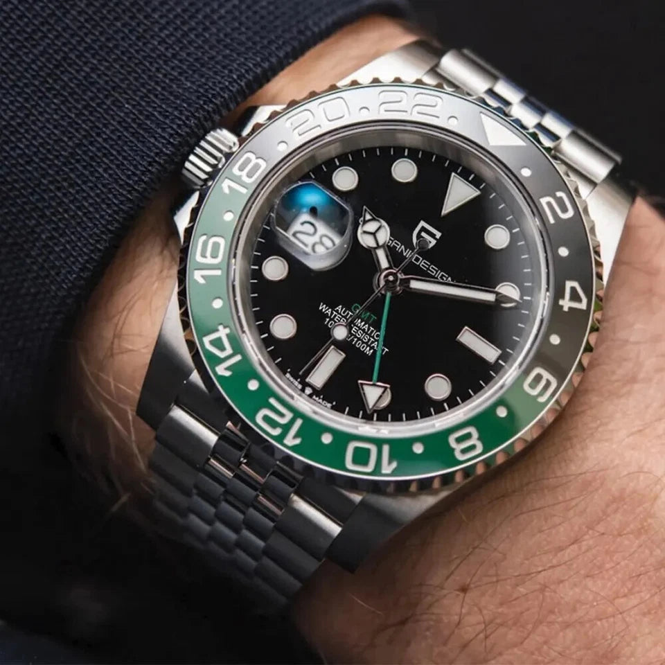 Watch with green and silver accents on a wrist against a dark background