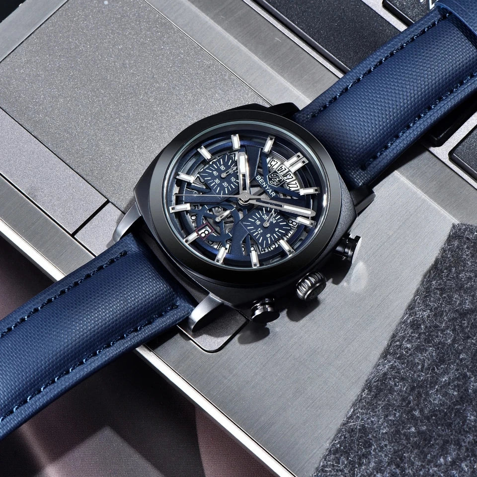 Watch with blue strap on a metallic surface