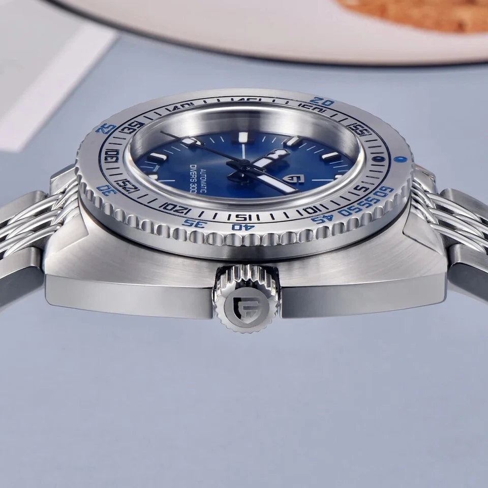 Silver watch with blue dial on a light gray background