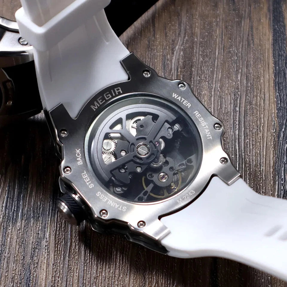 Close-up of a white watch with mechanical back cover on a wooden surface