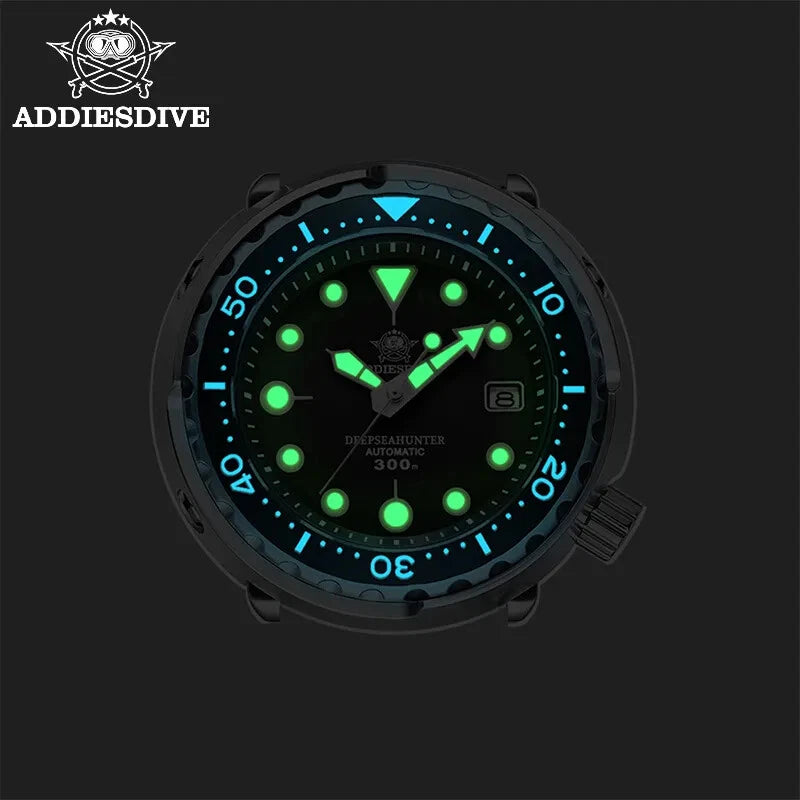 Glowing watch face with green lights on a black background, featuring the AddiesDive brand.