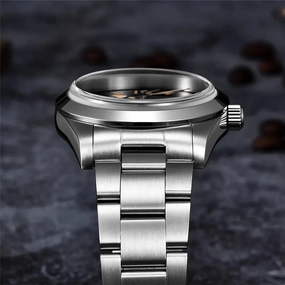 Silver watch with a metallic band on a dark textured background