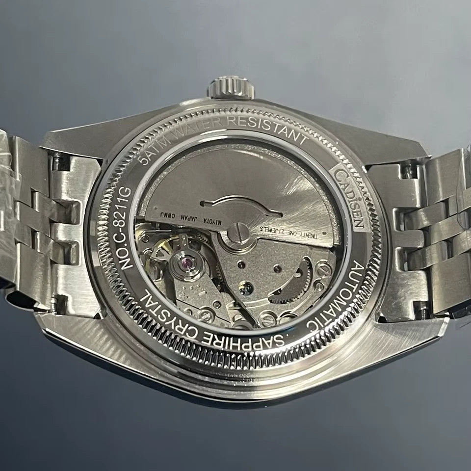 Silver watch with visible brand name on a gray background