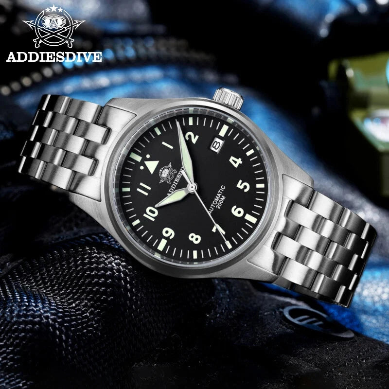 Silver wristwatch with black dial on a textured surface, featuring ADDIESDIVE branding.