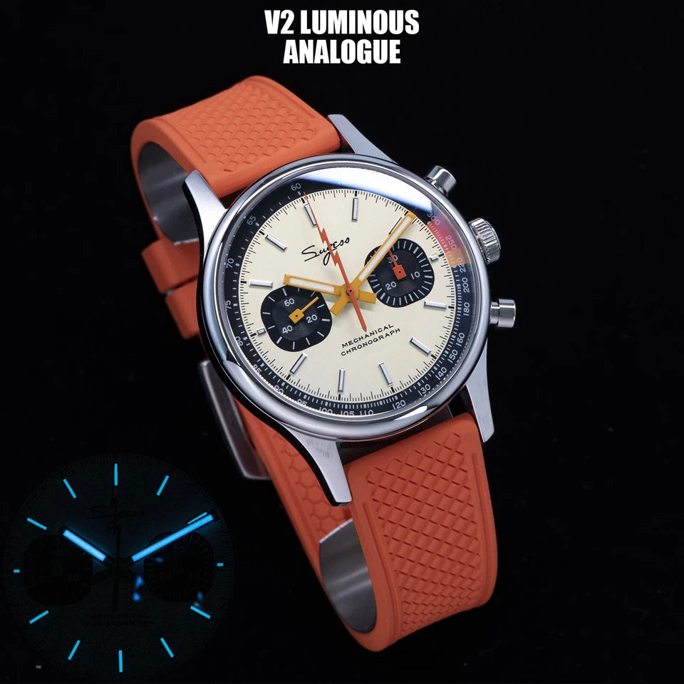 Watch with orange strap and detailed face on black background, featuring 'V2 Luminous Analogue' text.