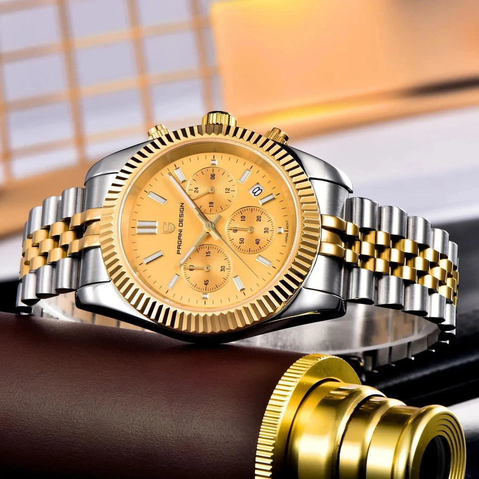 Gold and silver watch with detailed face on a blurred background
