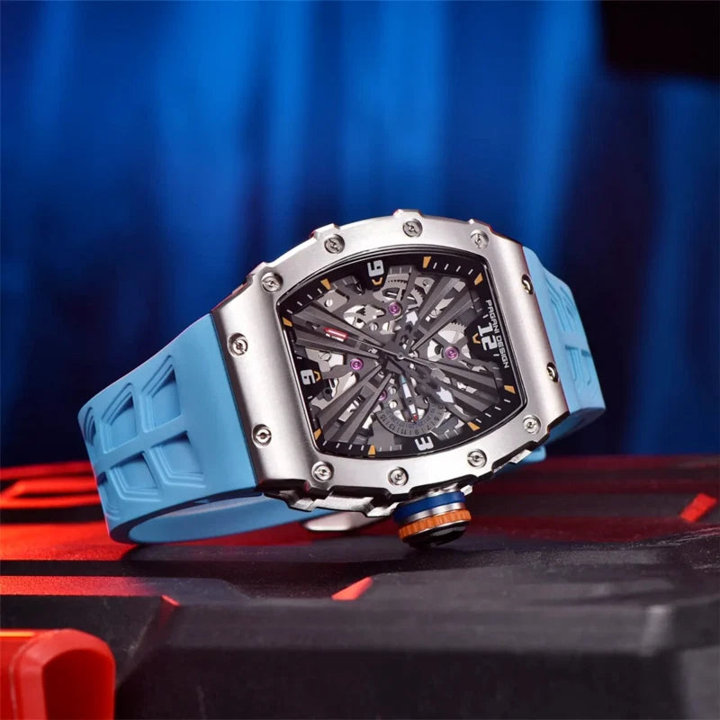 Watch with a blue strap on a reflective surface with a blue background