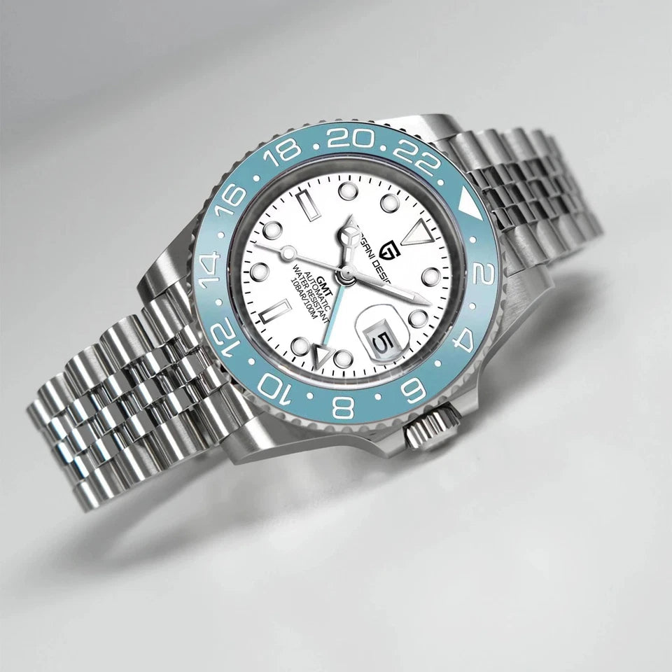 Watch with silver case and blue bezel on a light gray background
