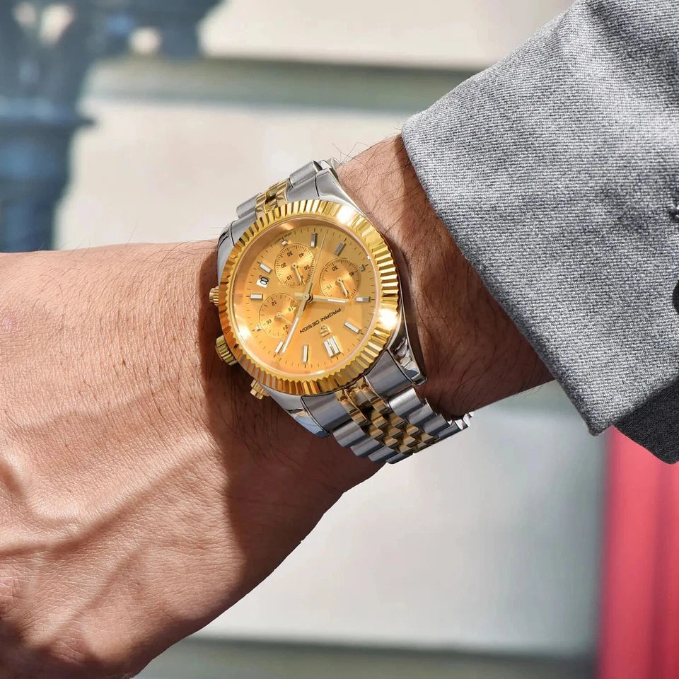 Gold and silver watch on a wrist with a blurred background