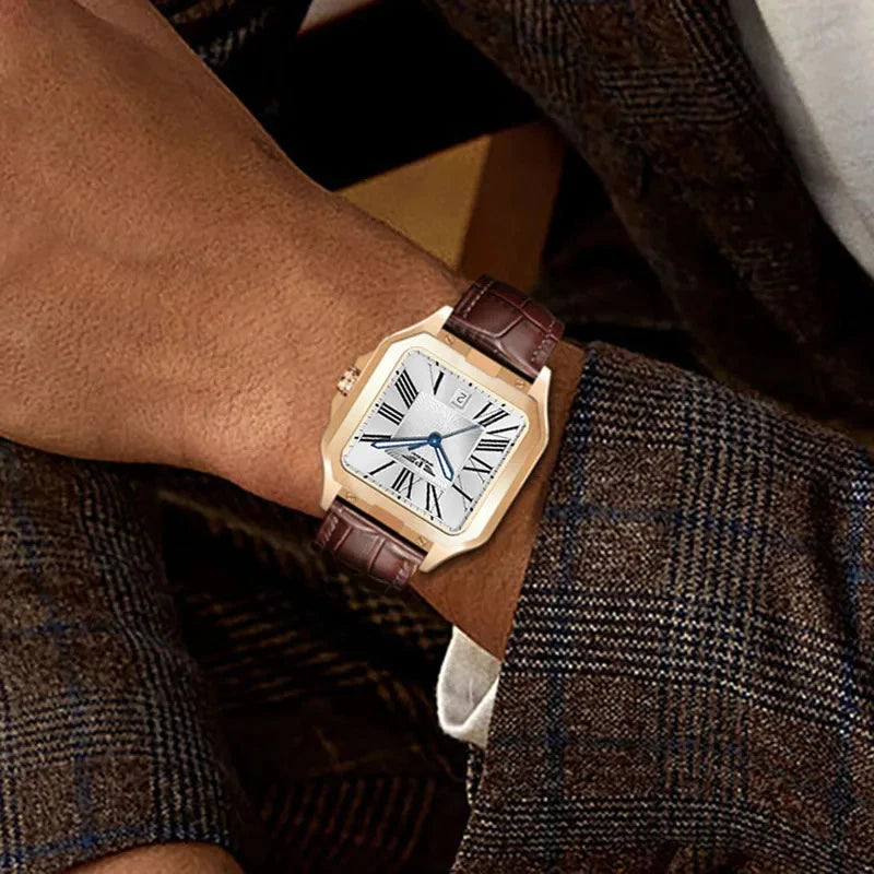Gold watch with brown leather strap worn on a wrist, with a blurred background.
