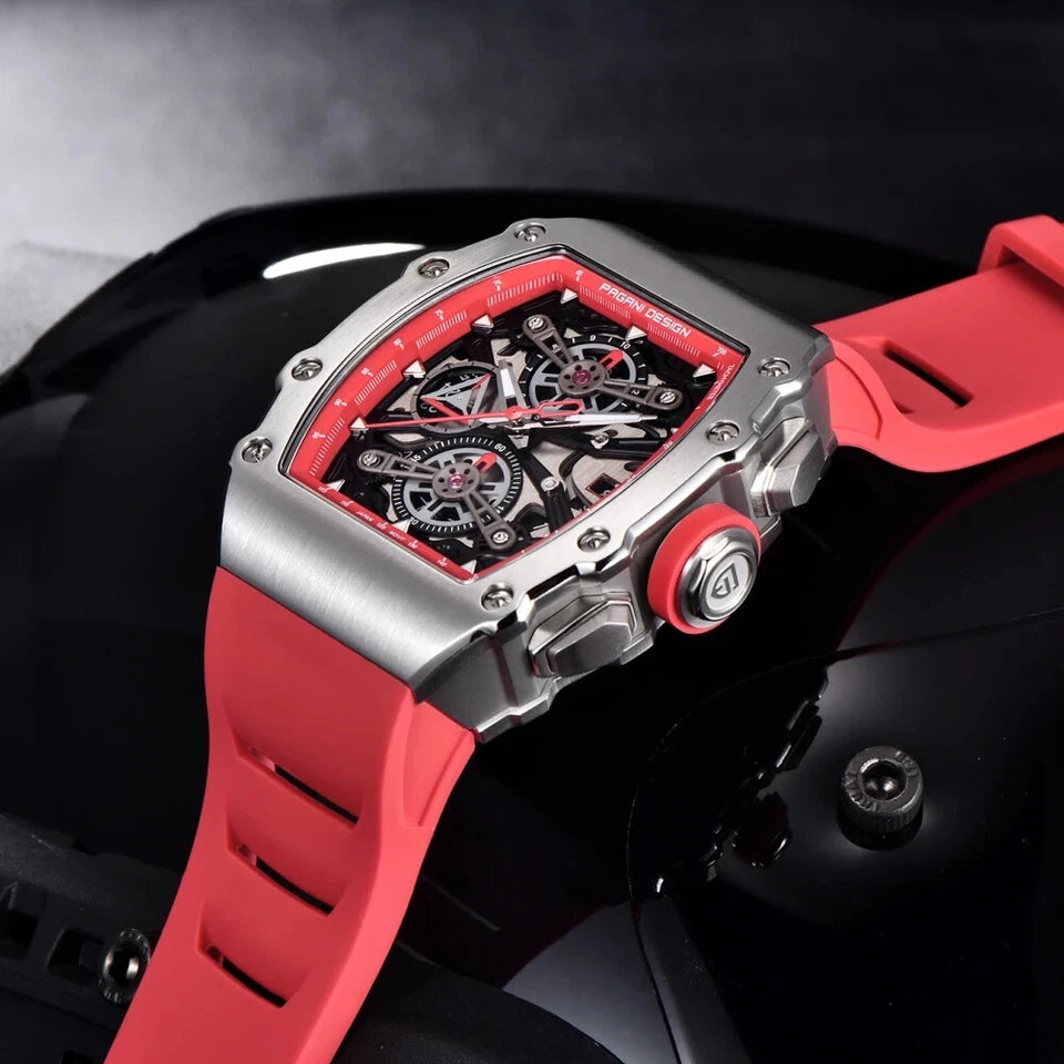 Luxury watch with red strap and intricate design on a dark background