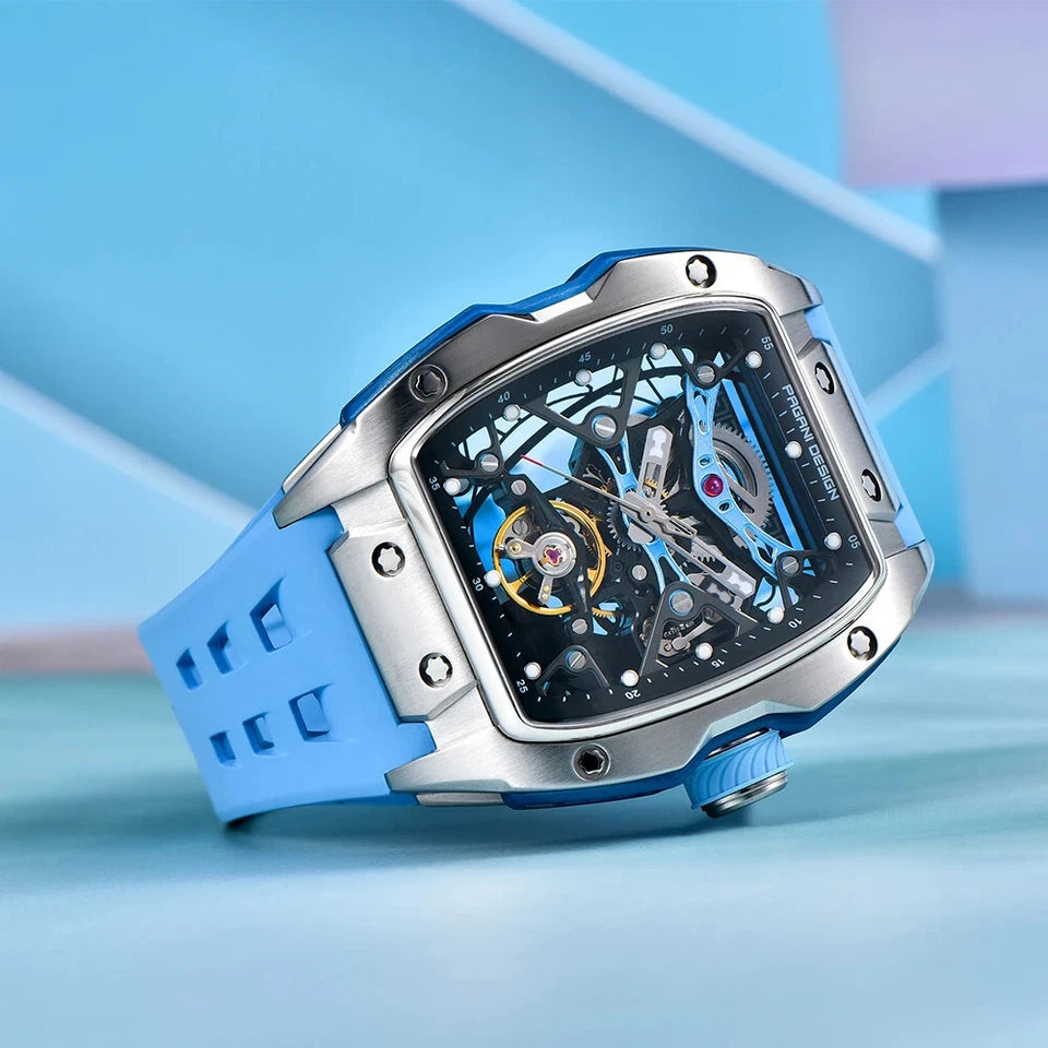 Luxury watch with blue strap and intricate design on a light blue background