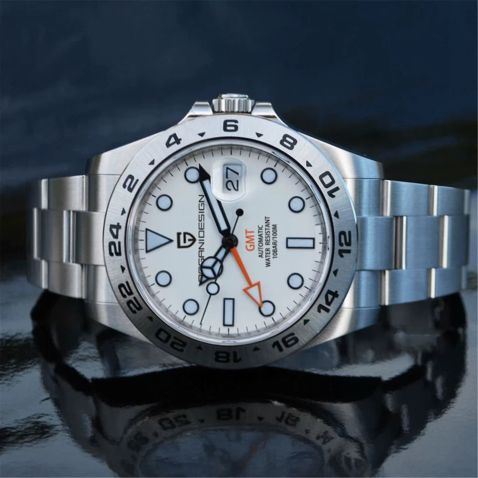 Silver watch with a white face on a reflective surface