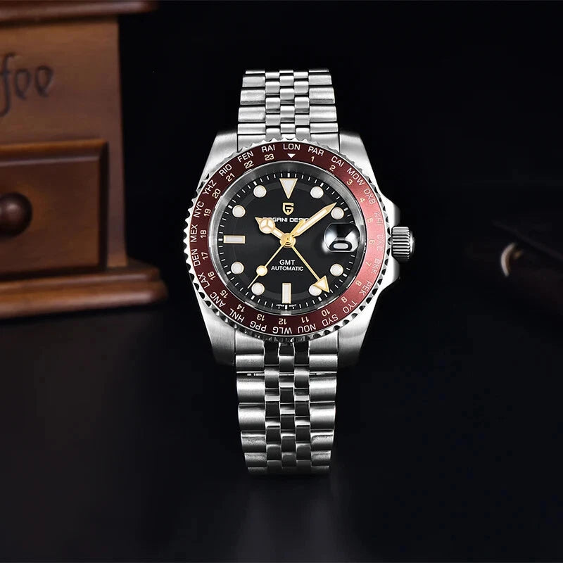 Silver watch with a black and red face on a dark background