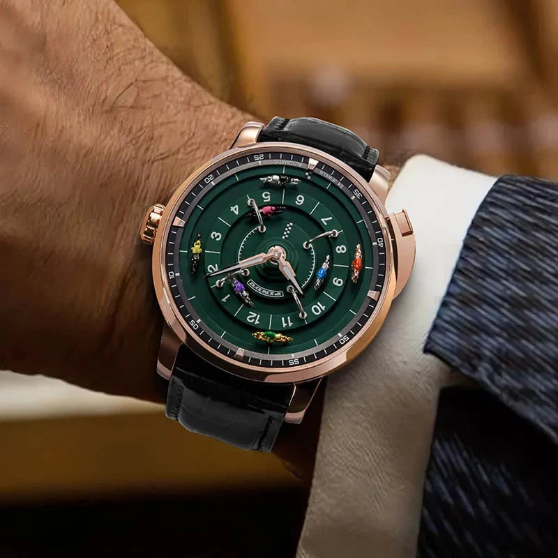 Luxury watch with a green face and rose gold case on a wrist against a blurred background