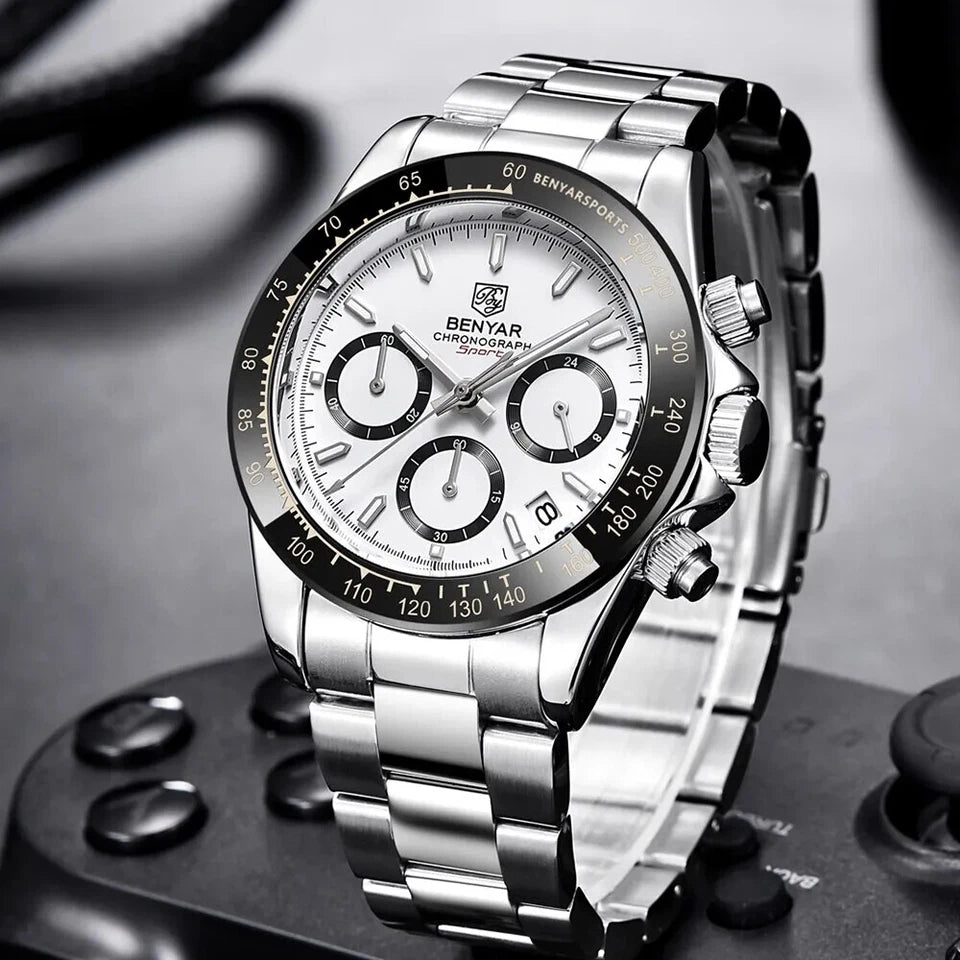 Silver wristwatch with a detailed face on a dark background