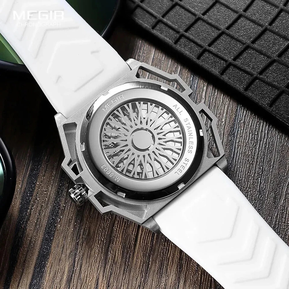 Watch with white strap and metallic case on wooden surface