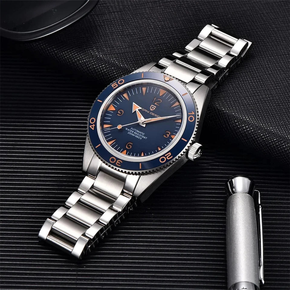 Silver watch with blue dial on a textured black surface