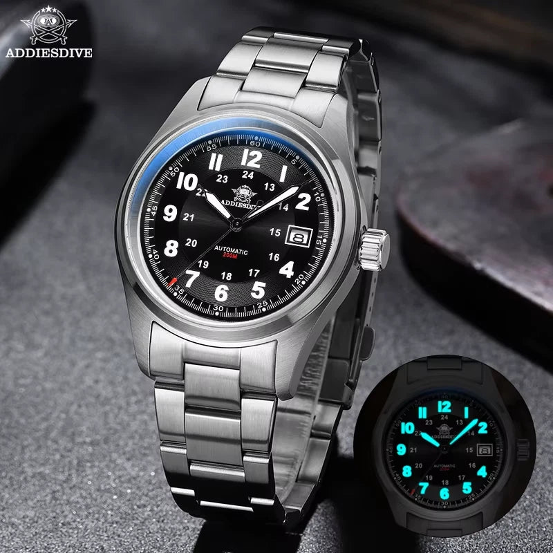Silver wristwatch with black dial on a dark textured surface, ADDIESDIVE brand visible.