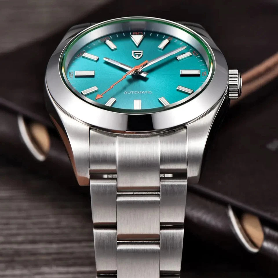 Silver watch with a turquoise dial on a dark background