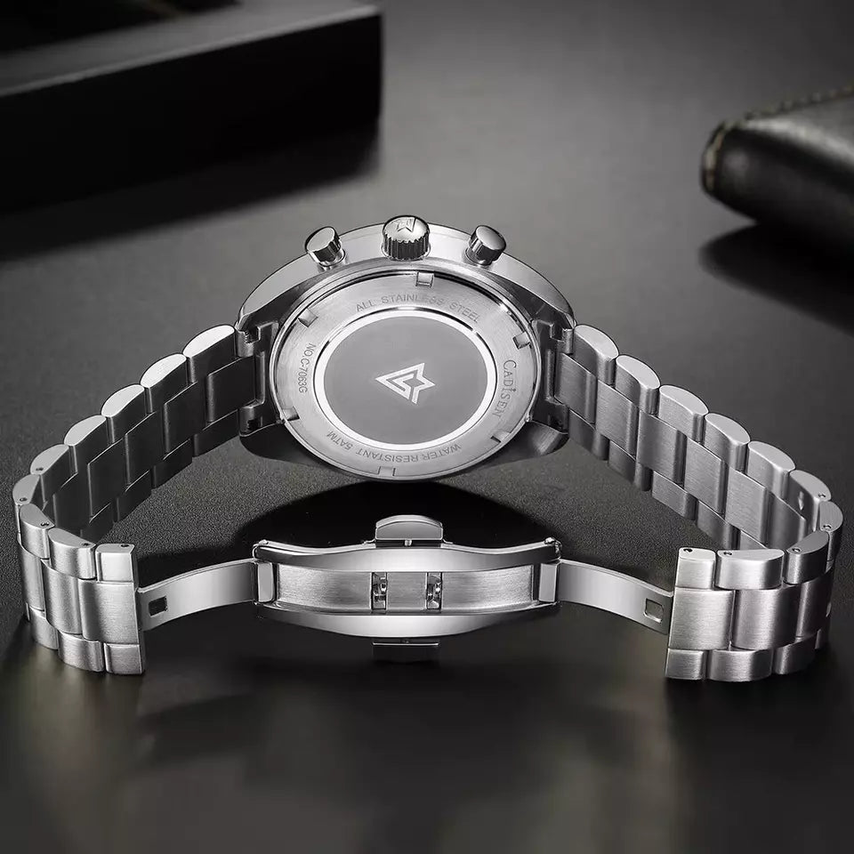 Silver watch with metal band on a dark surface