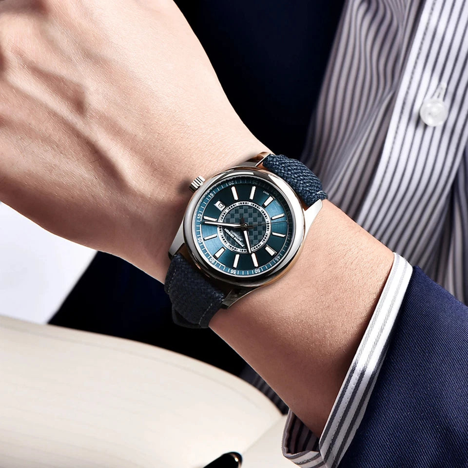Close-up of a wrist wearing a stylish watch with a blue face and dark strap.