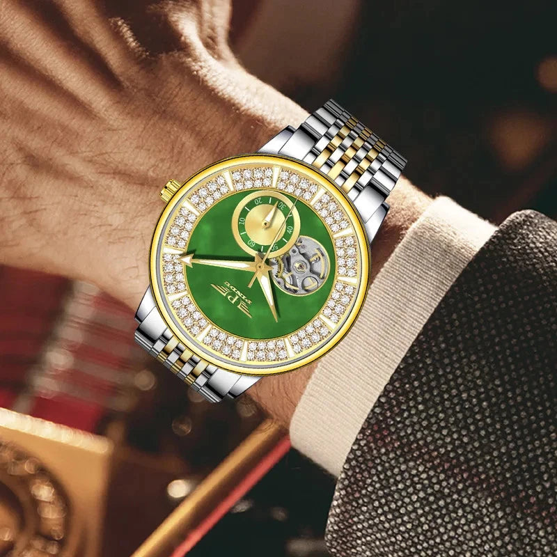 Luxury watch with green face and diamond accents on a wrist, blurred background