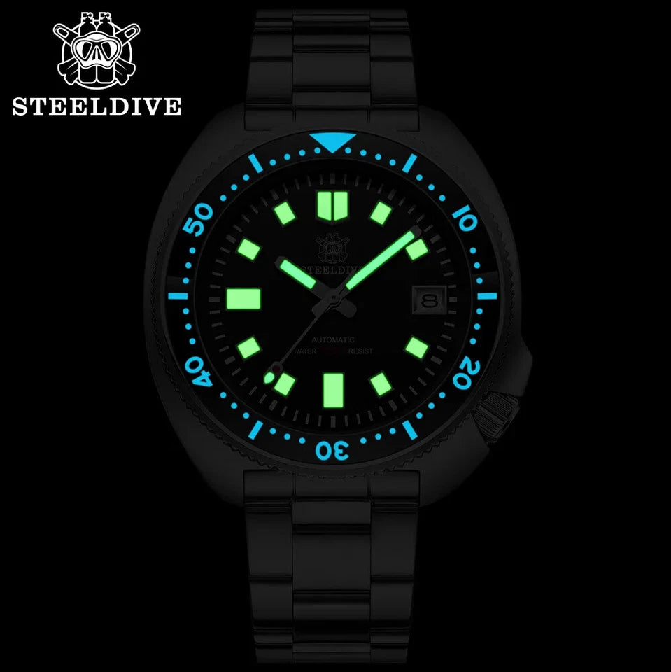 Black dive watch with glowing green and blue face on a black background, featuring the Steeldive brand.