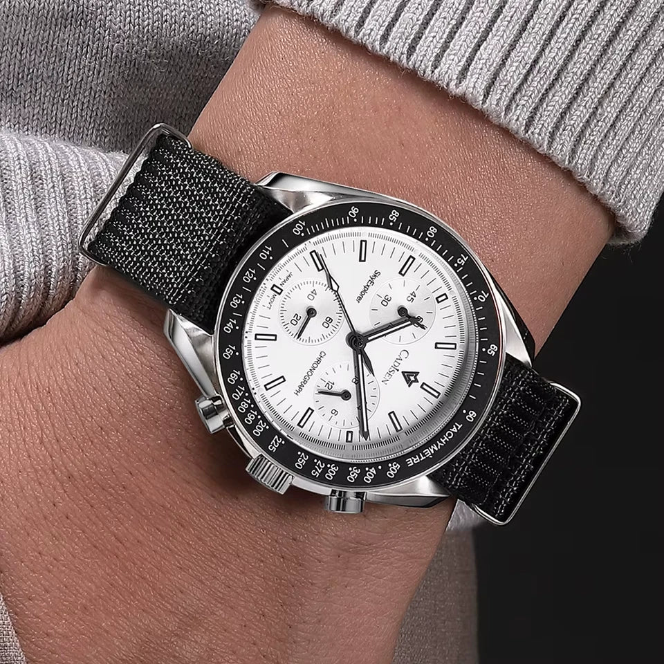 Wrist wearing a watch with a black strap and white face