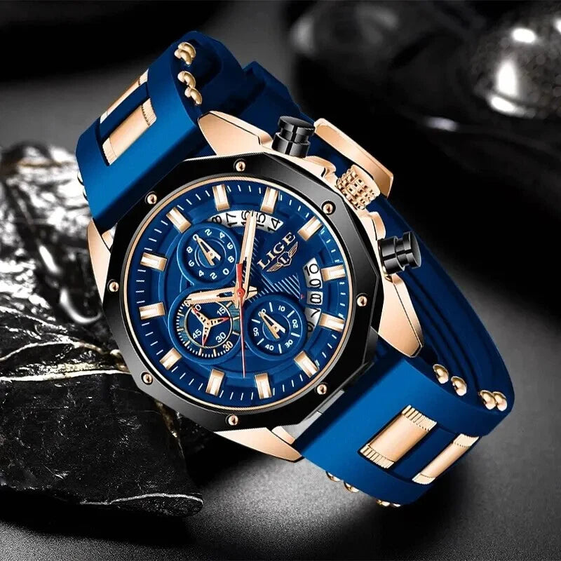 Blue and rose gold watch on a dark background