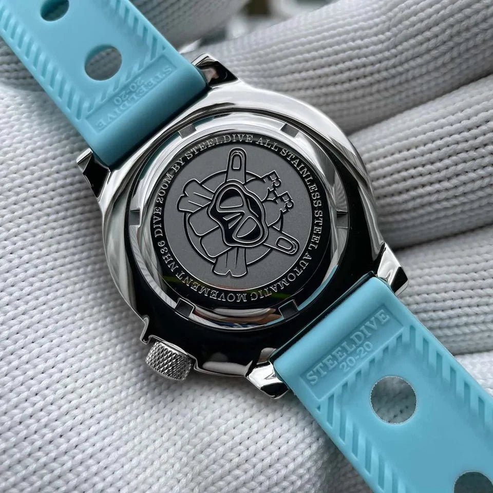 Close-up of a watch with a blue strap on a textured gray background