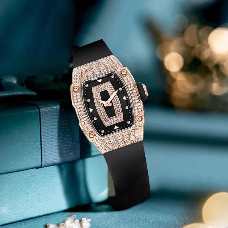 Luxury watch with black strap and rose gold case on a blue background