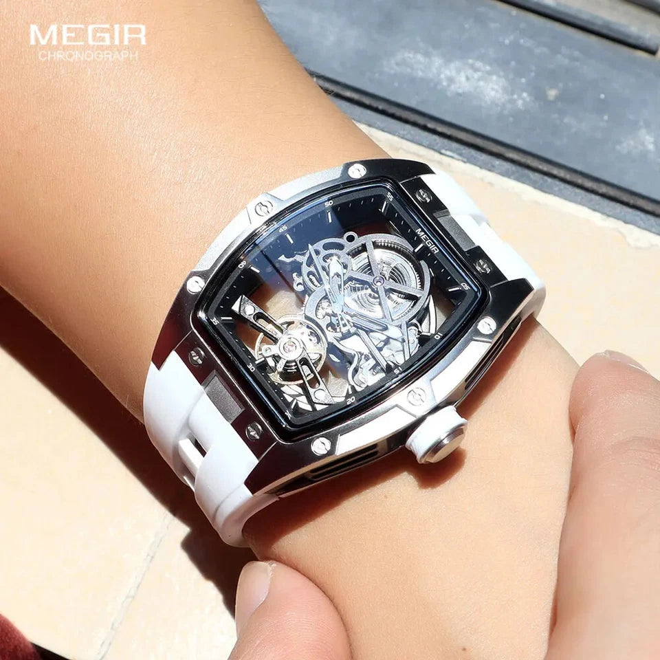 Luxury watch with white strap on a wrist, brand 'MEGIR' visible