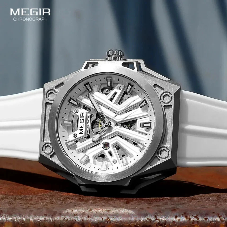 Silver Megir chronograph watch with a white strap on a wooden surface