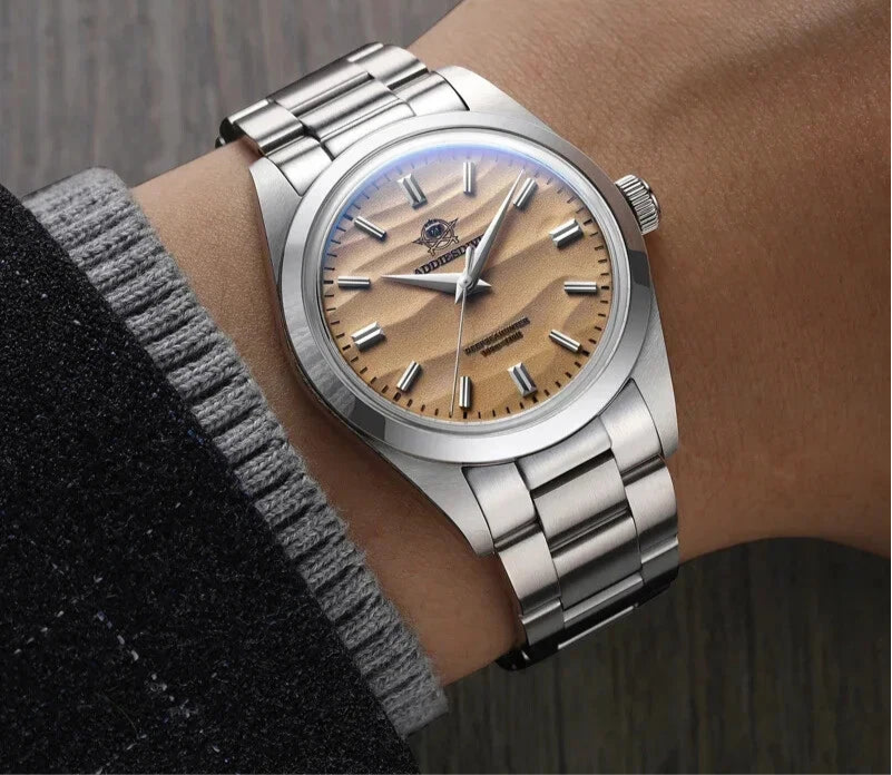 Silver wristwatch with wooden dial on a wrist, brand 'ADDIESDIVE' visible